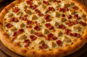 Homemade Chicken Bacon Ranch Pizza with golden crust, melted mozzarella, crispy bacon, and creamy ranch dressing — the ultimate comfort food recipe everyone craves.